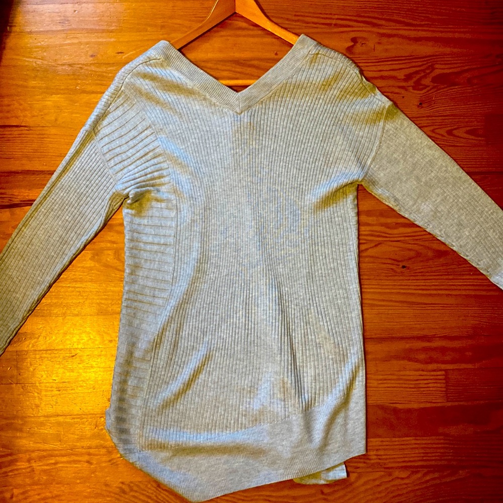 Kaari Blue large v-neck grey long sleeve tunic; bottom hem is angled